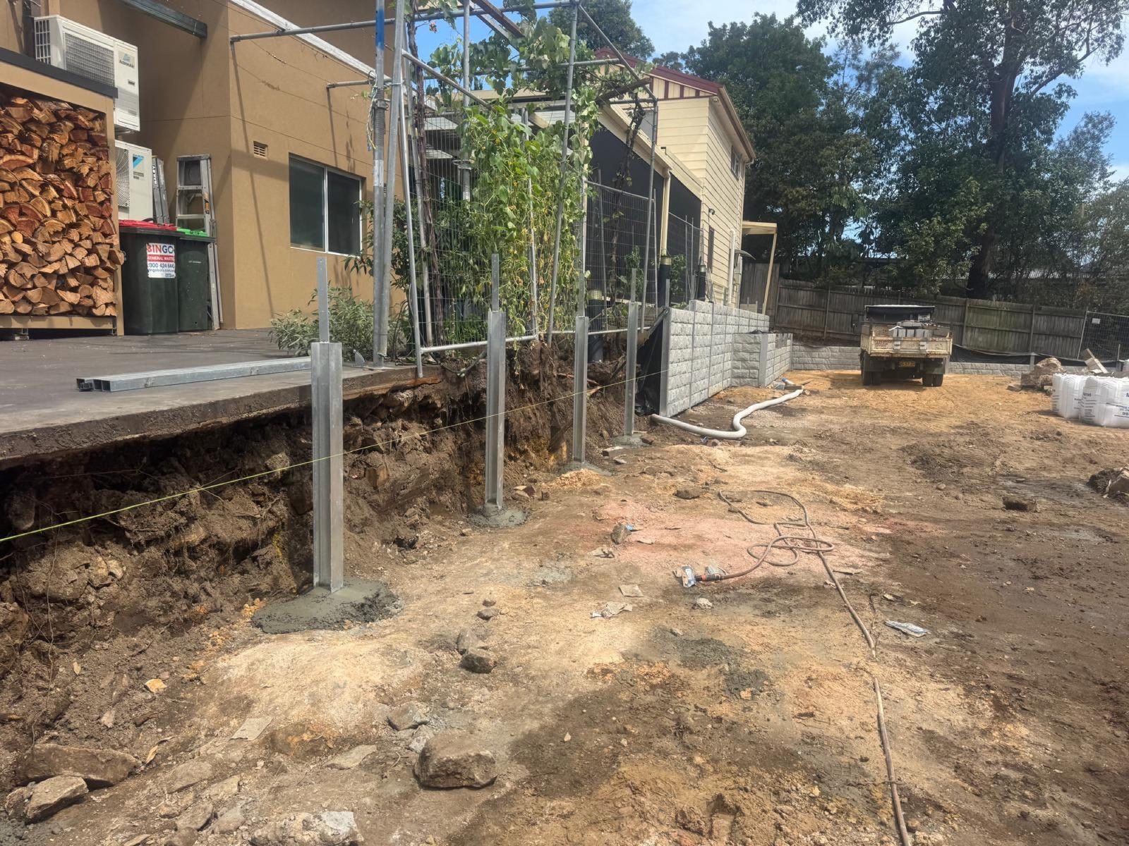 Steel posts being set in concrete